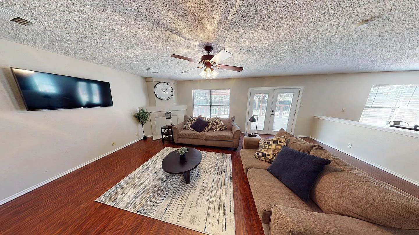 Charming Rue De Lis Home with Vaulted Ceilings & Fireplace — Photo 4