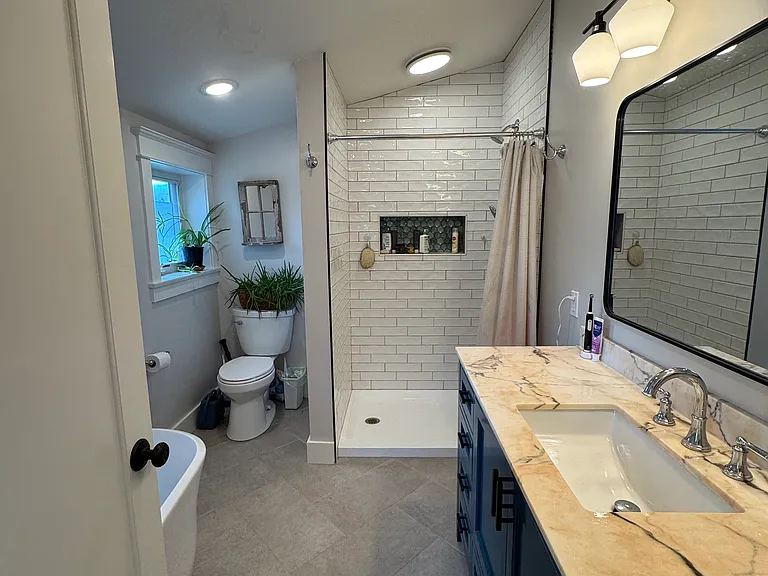 primary bath with soaking tub and shower