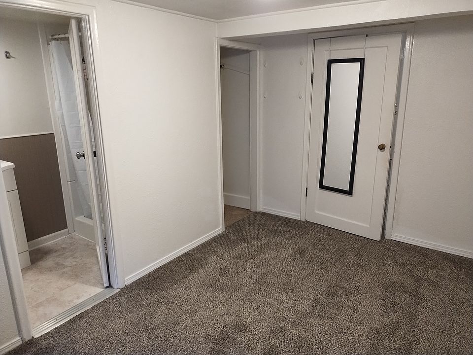 Bedroom with doorway to bathroom.