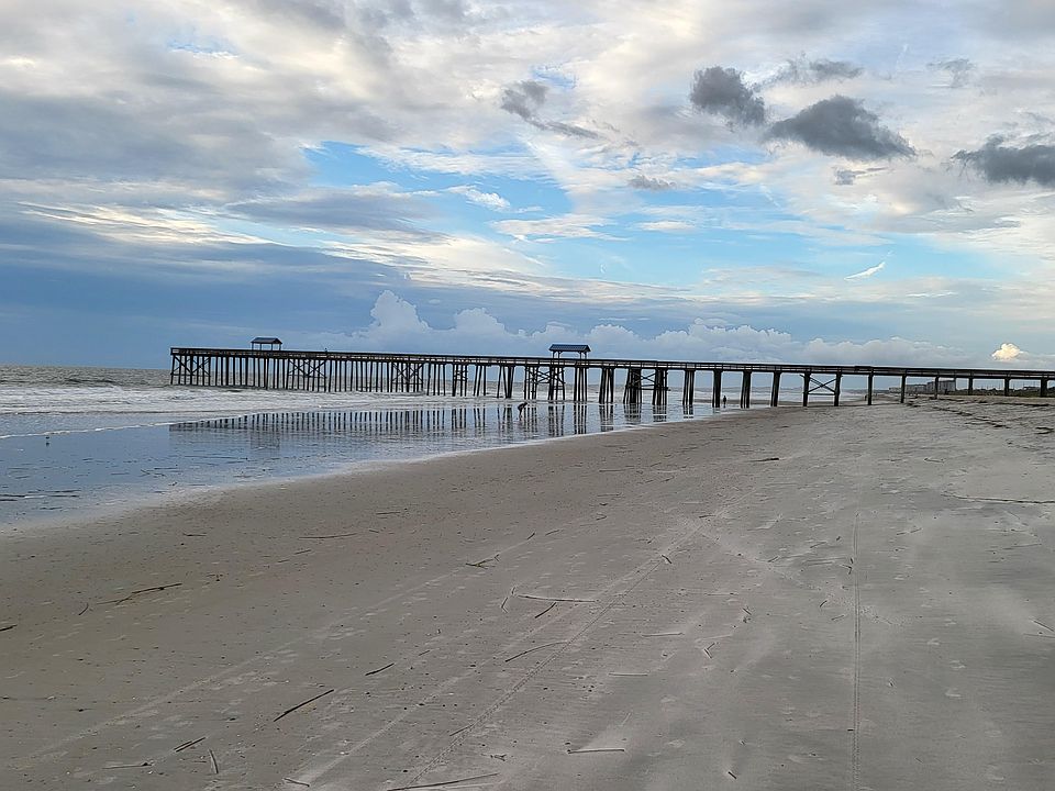 Adjacent to the pier and across the street from The Surf restaurant and bar.