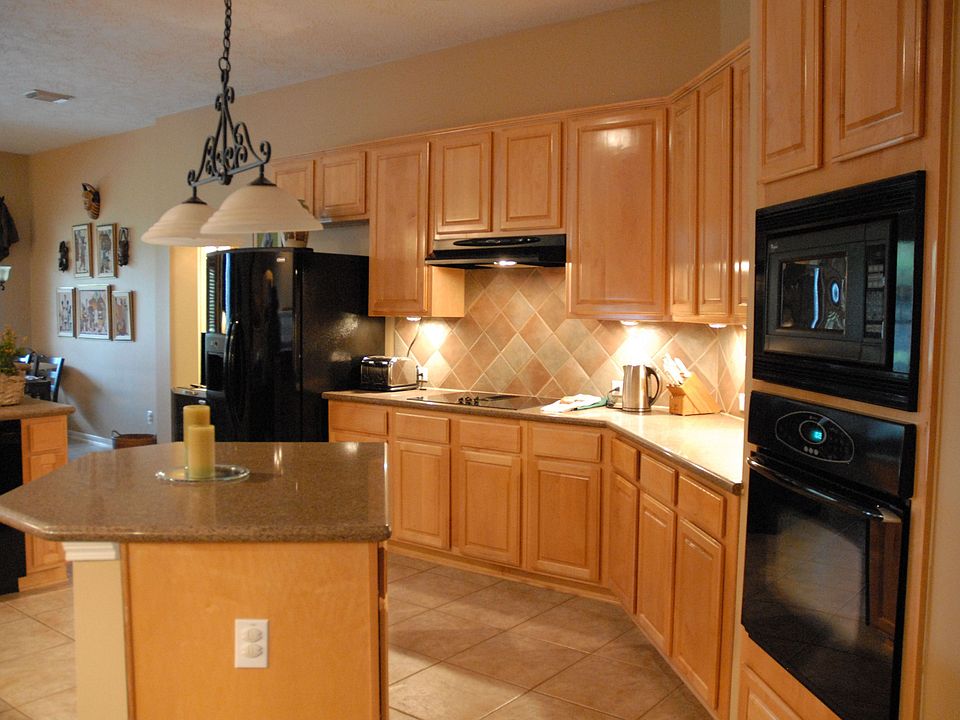 Spacious kitchen w/island & updated black appliances.