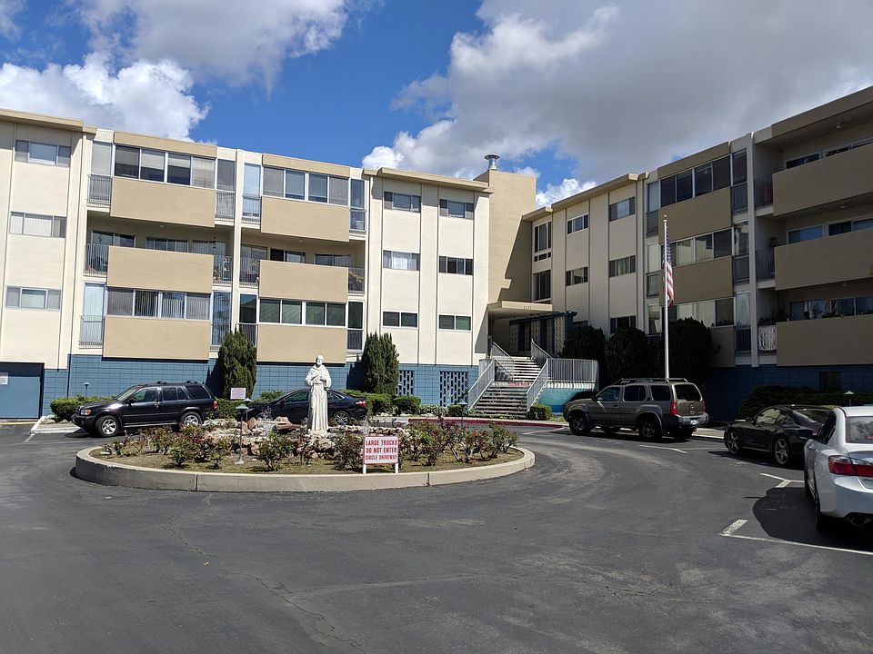 Front view of building complex, newly painted