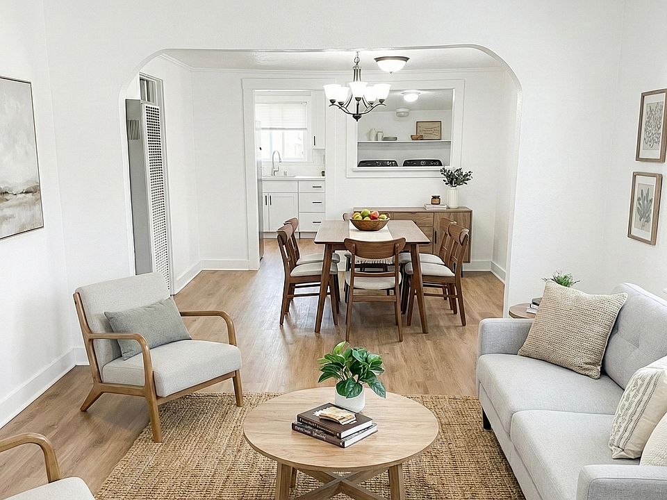 This is a cozy open concept living, dining, and kitchen space
