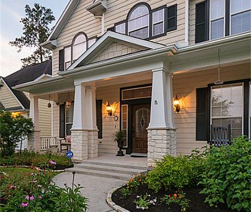 Front entry features welcoming architecture and open front porch.