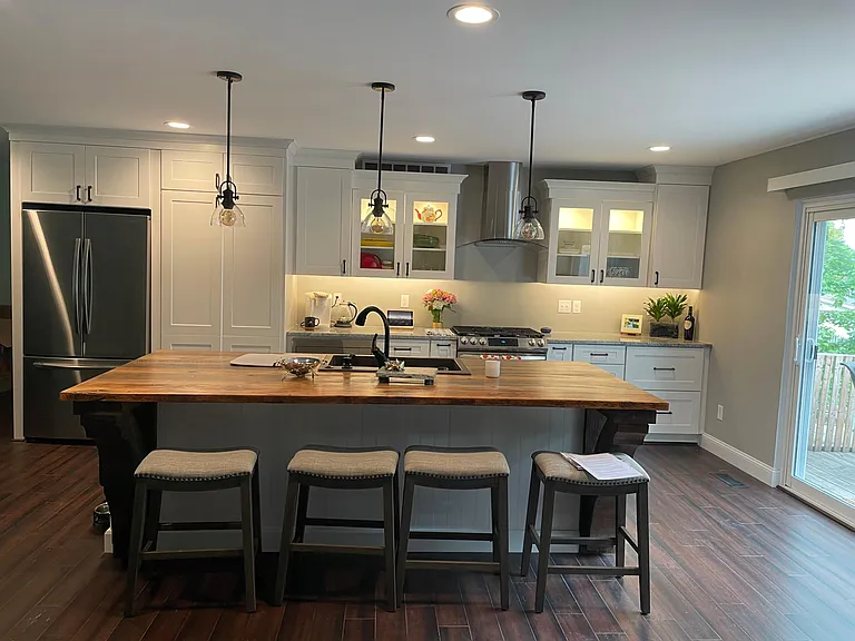 Gorgeous modern Kitchen with all new stainless appliances (gas stove), Large 4 person island made with stunning warm antique old barnwood top, luxury lighting finishes and walk-in large hidden pantry.