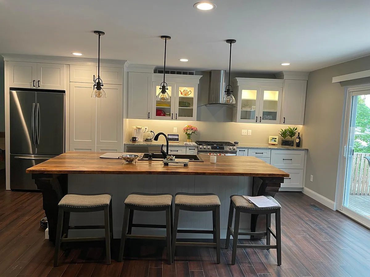 Gorgeous modern Kitchen with all new stainless appliances (gas stove), Large 4 person island made with stunning warm antique old barnwood top, luxury lighting finishes and walk-in large hidden pantry. - 15737 Plymton Ln