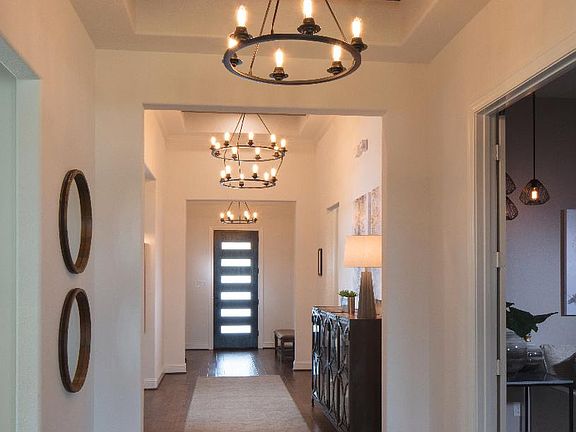 Lovely elongated foyer with tray ceiling