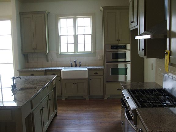 Gourmet kitchen with 6 burner stove, farm sink, double wall oven