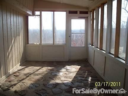 Porch : Screened in porch, with removable plexi-glass windows.