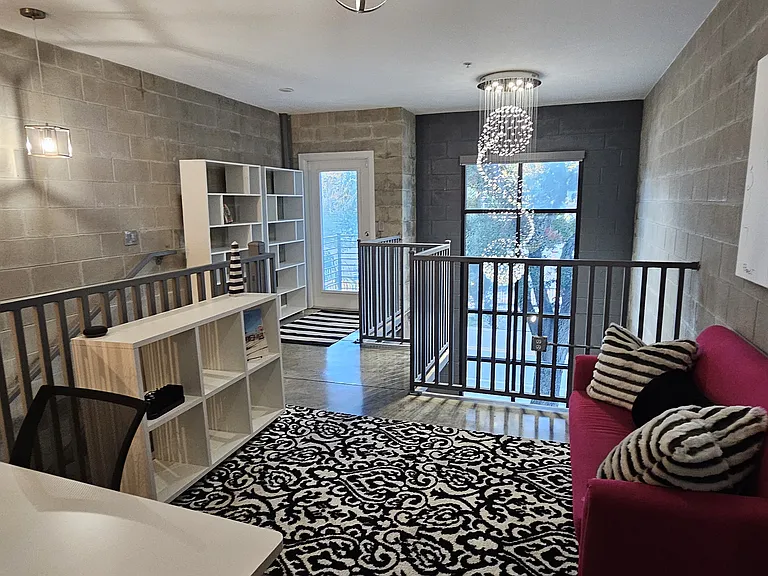 View from loft space. Door provides access to front balcony.
