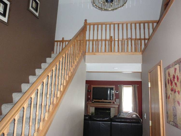 Entering into the home is the Open Concept Stairway.