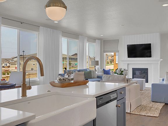 Kitchen to great room. Photo representing home to be built and may demonstrate optional features