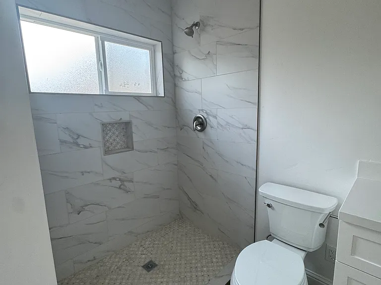 Master bath walk in shower. Tenant must provide rod and shower curtain.