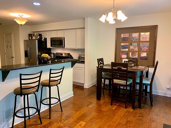 Open concept with breakfast bar and table space