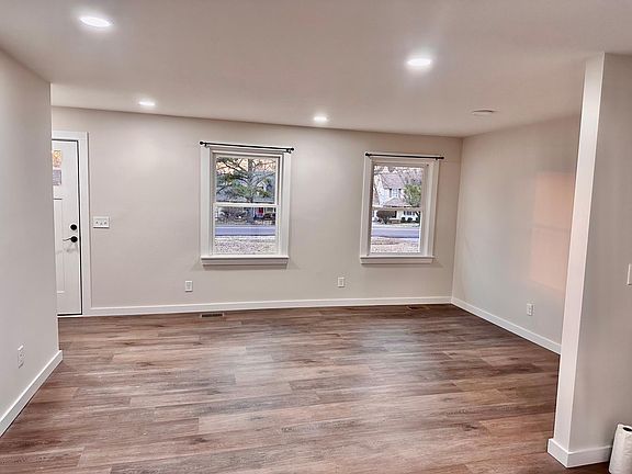 Large Family Room With Luxury Plank Flooring