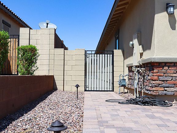 Side gate of the house painted cottage grey to give the house a modern look