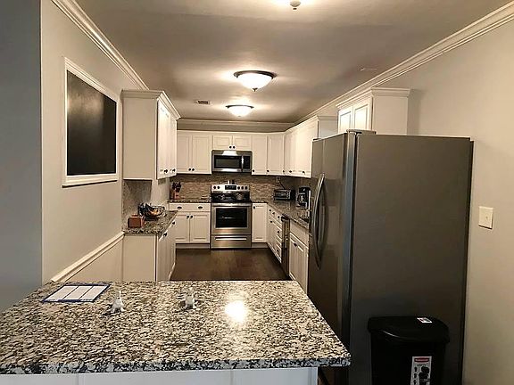 Kitchen with granite countertops and stainless appliances