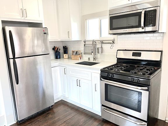 Kitchen (pre-floors refinished in March 2024)