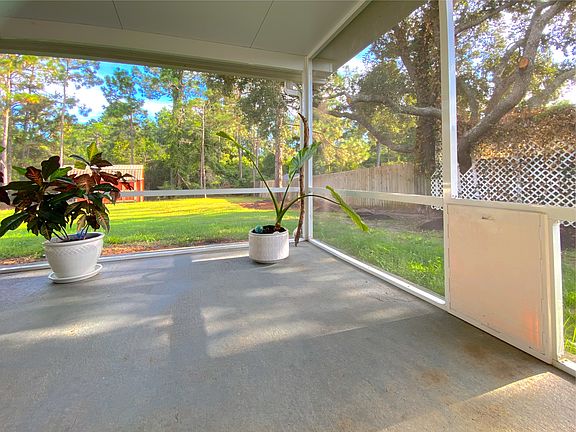 Patio on West end looking towards backyard. Built-in doggie door with cover installed.
