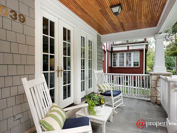 The darling front porch welcomes you home.