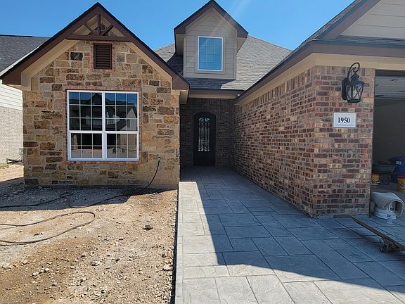 Beautiful stone and brick exterior. Will be fully landscaped with sod yard.