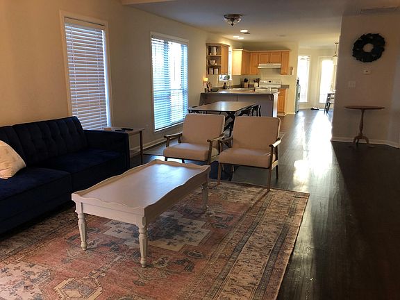 Living room, dining area and kitchen as viewed from front entry.