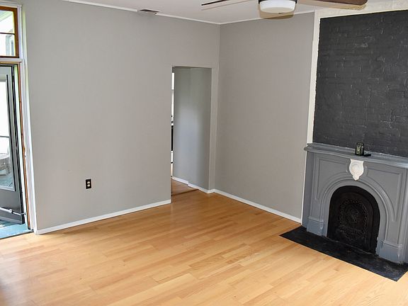 Living room with original fireplace