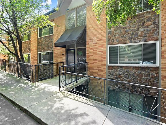 Front entrance, 2 free parking spaces, ample visitor parking