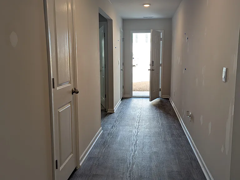 Front hallway empty of furniture. Paint repair in progress (repainting any nail holes or scuffs)