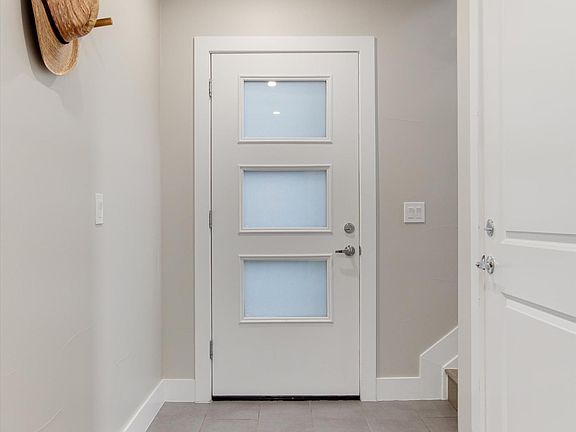 Front entry. Door on the right goes to unit's single-car garage.