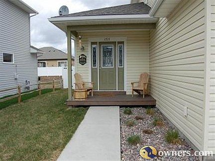 Front door with landscaping
