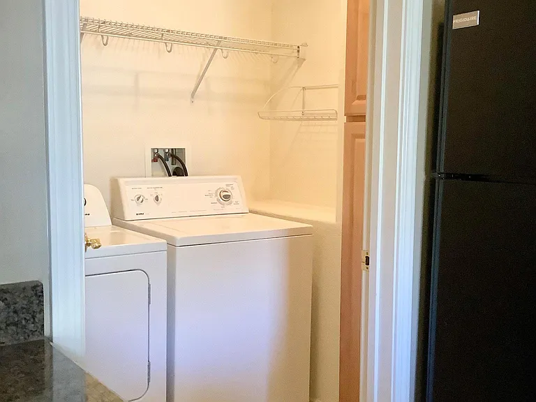 Inside laundry room adjacent to the Kitchen.