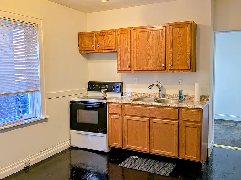 Kitchen with Electric stove and cooktop.