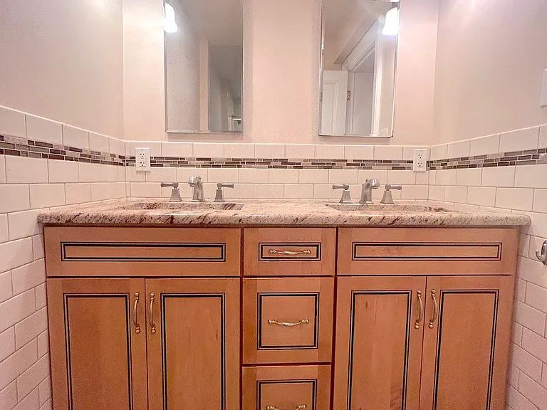 Front bedroom bathroom with double sink counter
