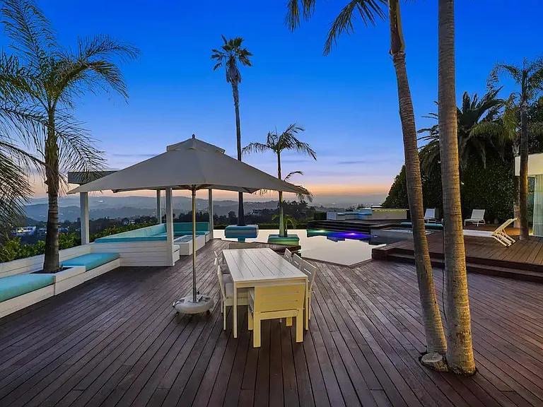 Witness the Breathtaking Sunset from the Outdoor Deck, as the sky paints a stunning canvas of colors.