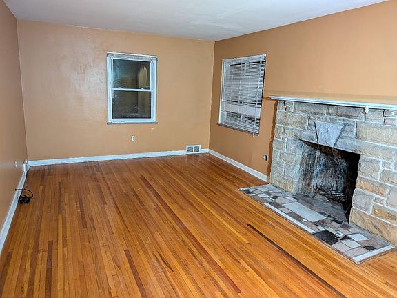 living room with working wood fireplace