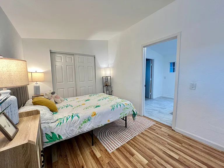 Spacious private bedroom with easy access to bathroom and in-unit laundry