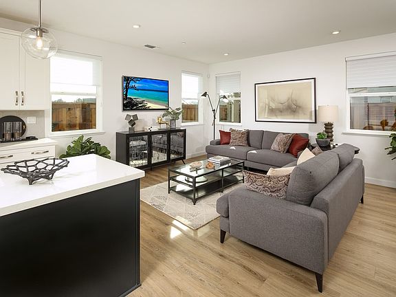 With an open layout, it seamlessly connects to the kitchen and dining area. It creates an atmosphere