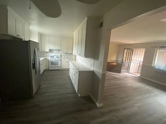 View of Kitchen & Living Space from Dining Space