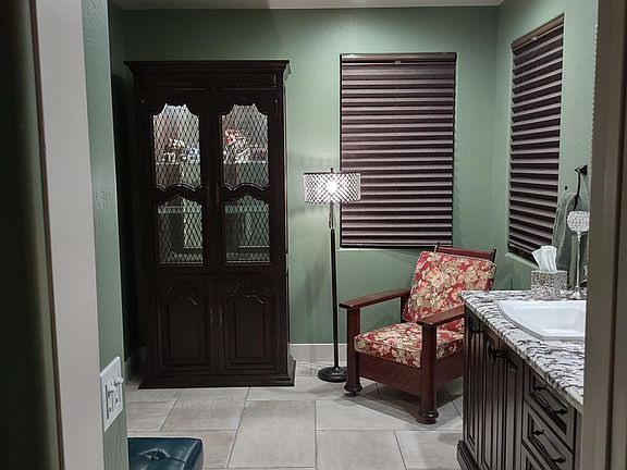 Primary bathroom, double sinks, spiral shower, enclosed toilet room