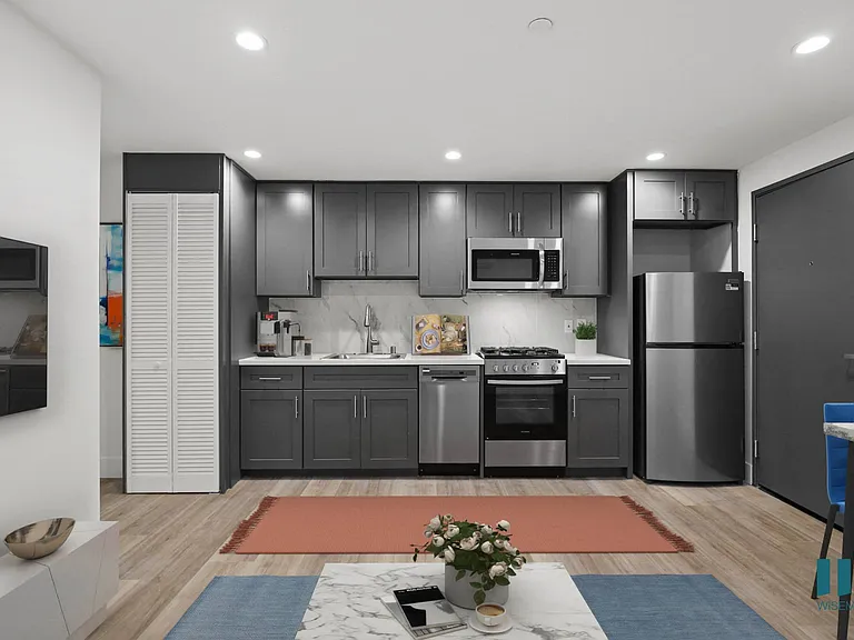 Open-Concept Kitchen with Stainless-Steel Appliances and In-Suite Washer & Dryer