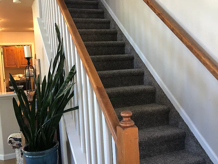 Stairs leading up to an additional bedroom, loft and private bathroom.