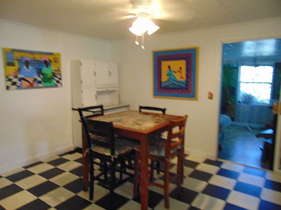 dining w/ sunroom beyond