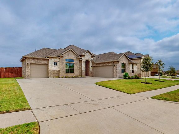 Envision coming home and driving up your expansive driveway into one of your garages with the option of 3 different spots inside