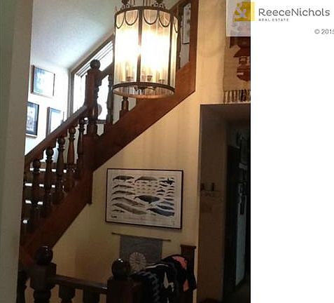 hand carved three story stair case with open view from the upper