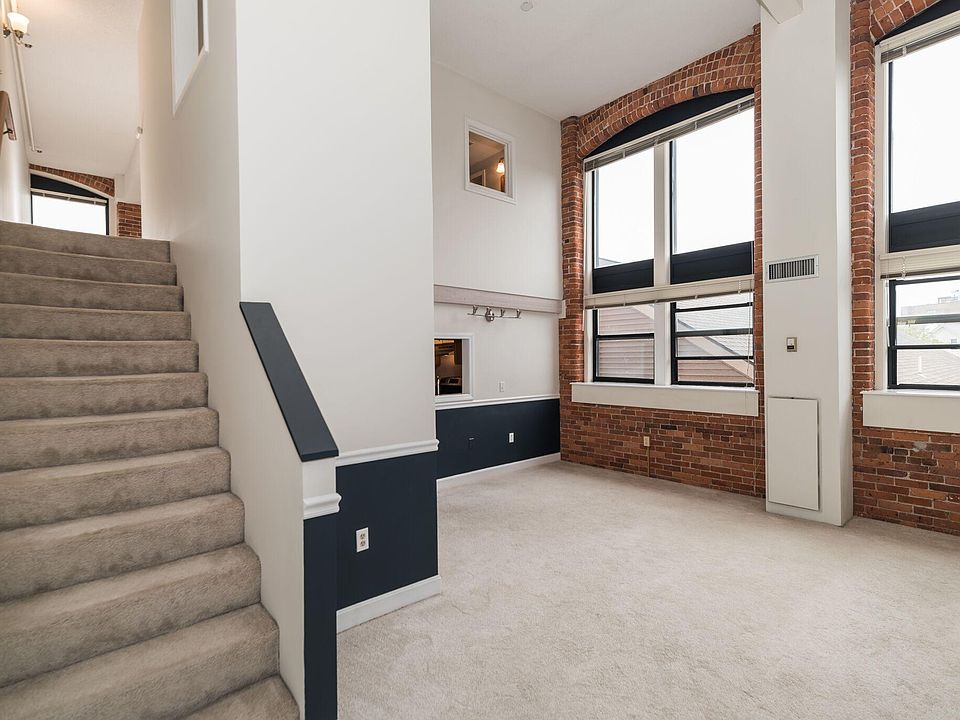 ENTRY VIEW - Lower Living Area/Steps to Loft Bedroom and Loft Bath