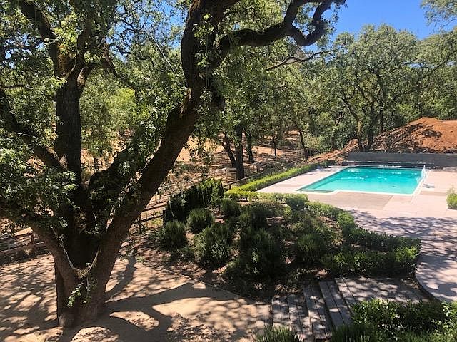 View of the equestrian trail and pool from the Master Bedroom deck