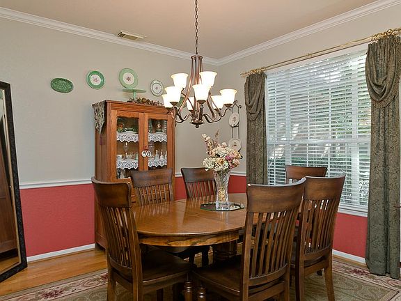 The elegant dining room greets you as you enter the home.