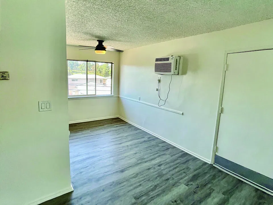 Large dining area and living room. Newly painted, hardwood floors for easy cleaning. New air condition unit to cool large rooms.