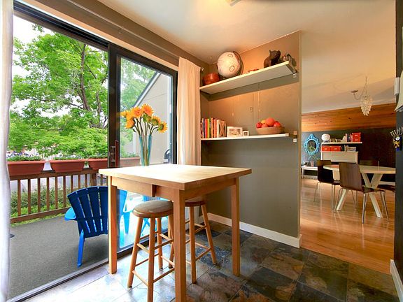 Kitchen looking out into living area & patio